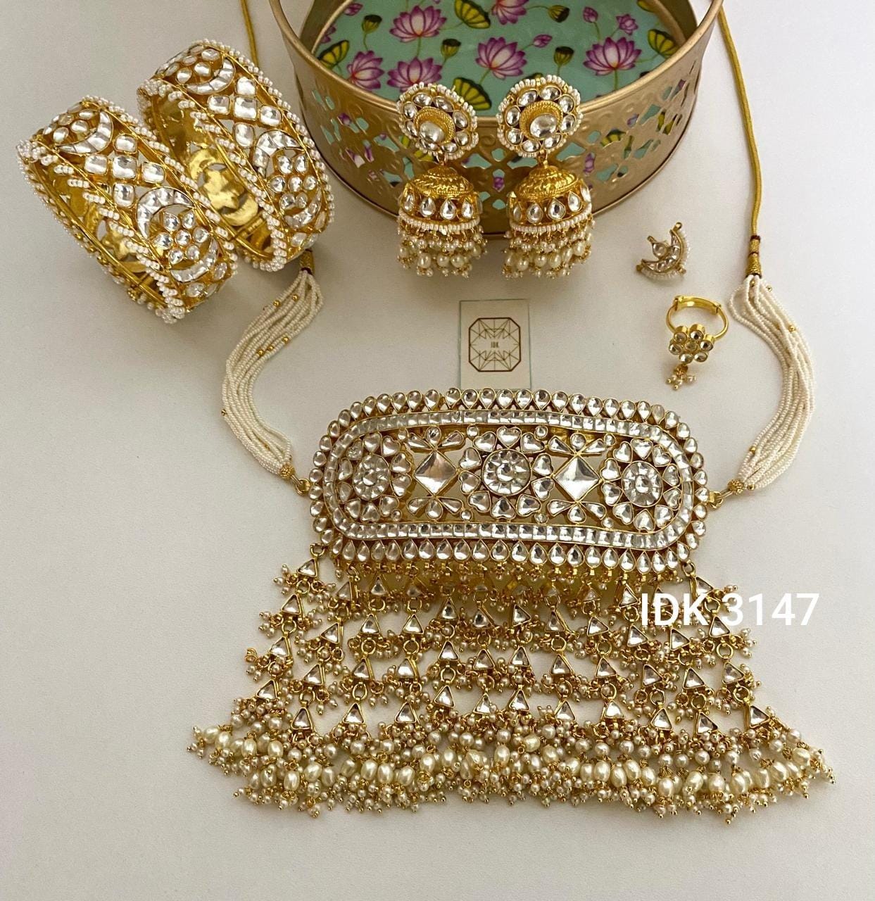 Pachi kundan bollywood style choker set with ring, nose ring ,jhumka earrings and bangles