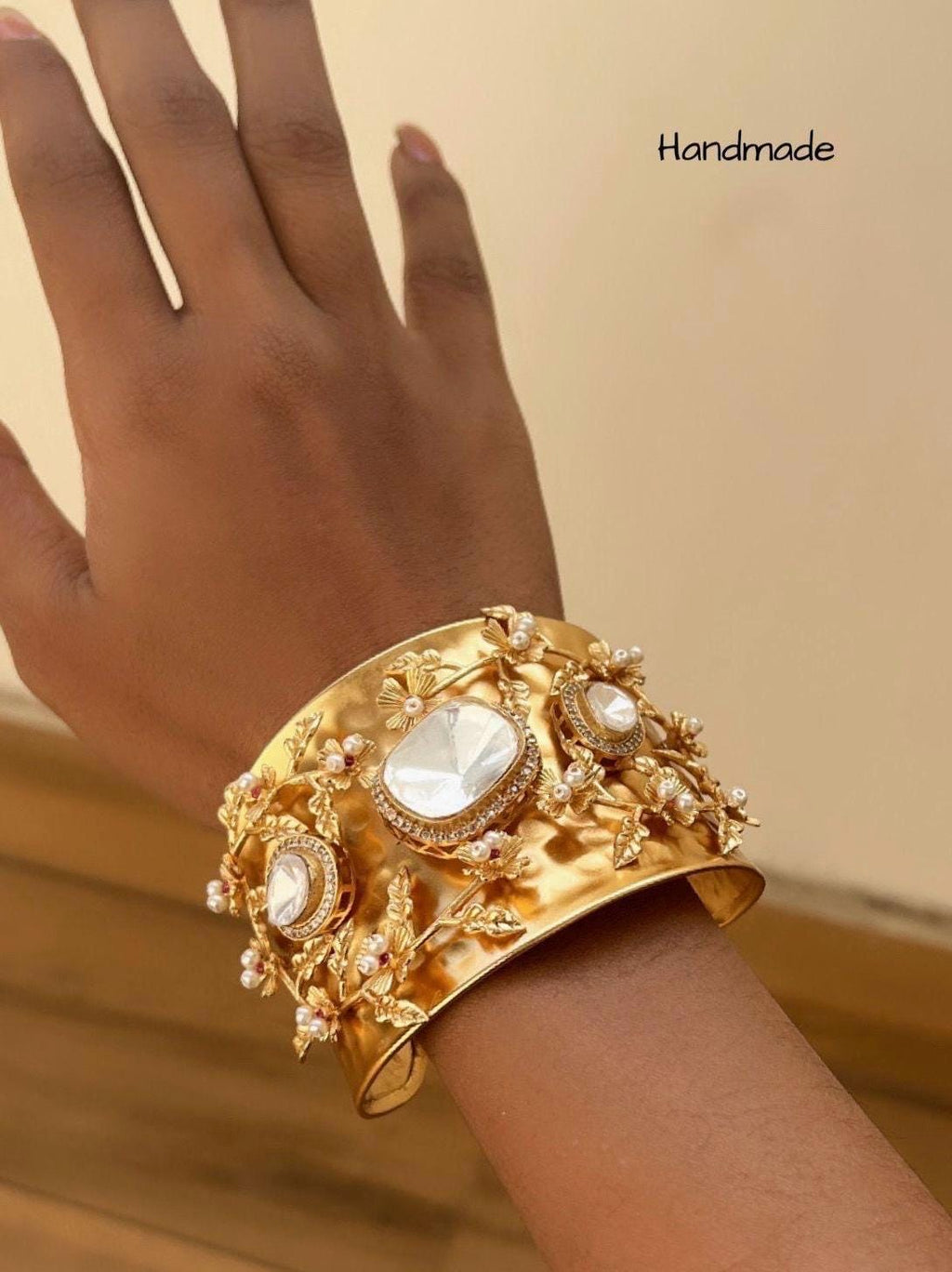 Masaba inspired Statement celebrity golden weaved openable cuff with Moroccan artistry and intricate carving alongside Polki doublet stones
