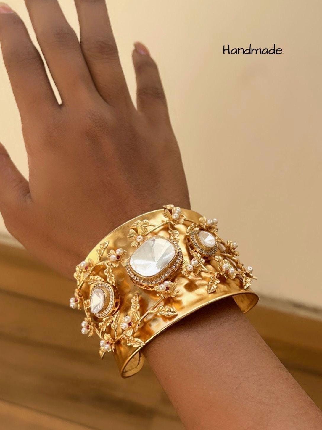 Masaba inspired Statement celebrity golden weaved openable cuff with Moroccan artistry and intricate carving alongside Polki doublet stones