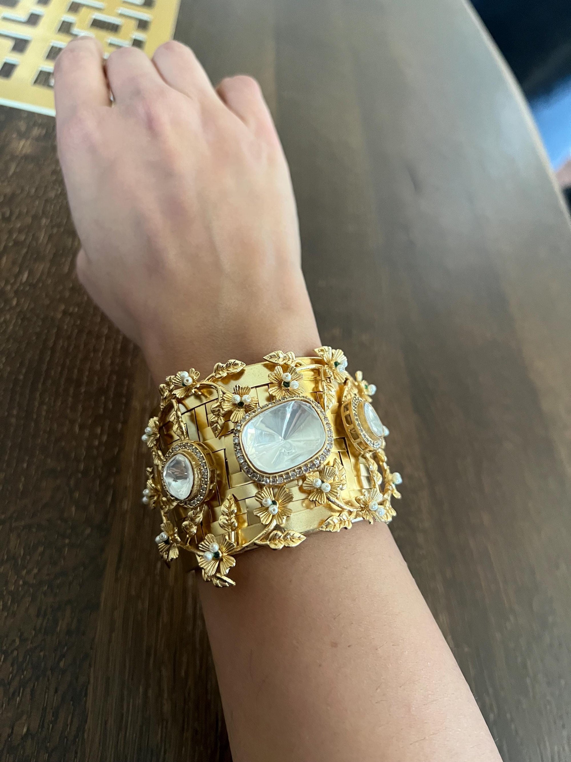 Masaba inspired Statement celebrity golden weaved openable cuff with Moroccan artistry and intricate carving alongside Polki doublet stones