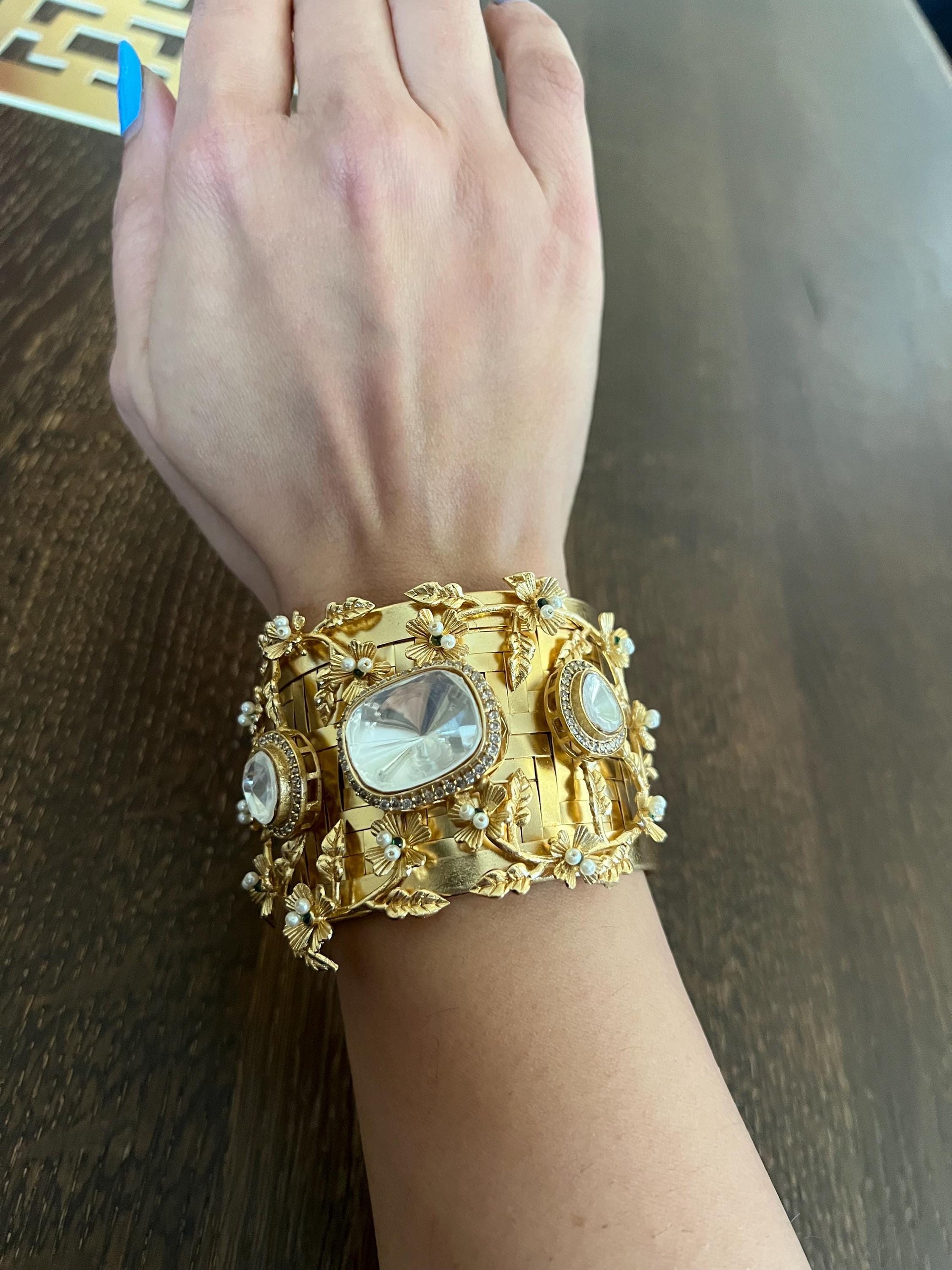 Masaba inspired Statement celebrity golden weaved openable cuff with Moroccan artistry and intricate carving alongside Polki doublet stones